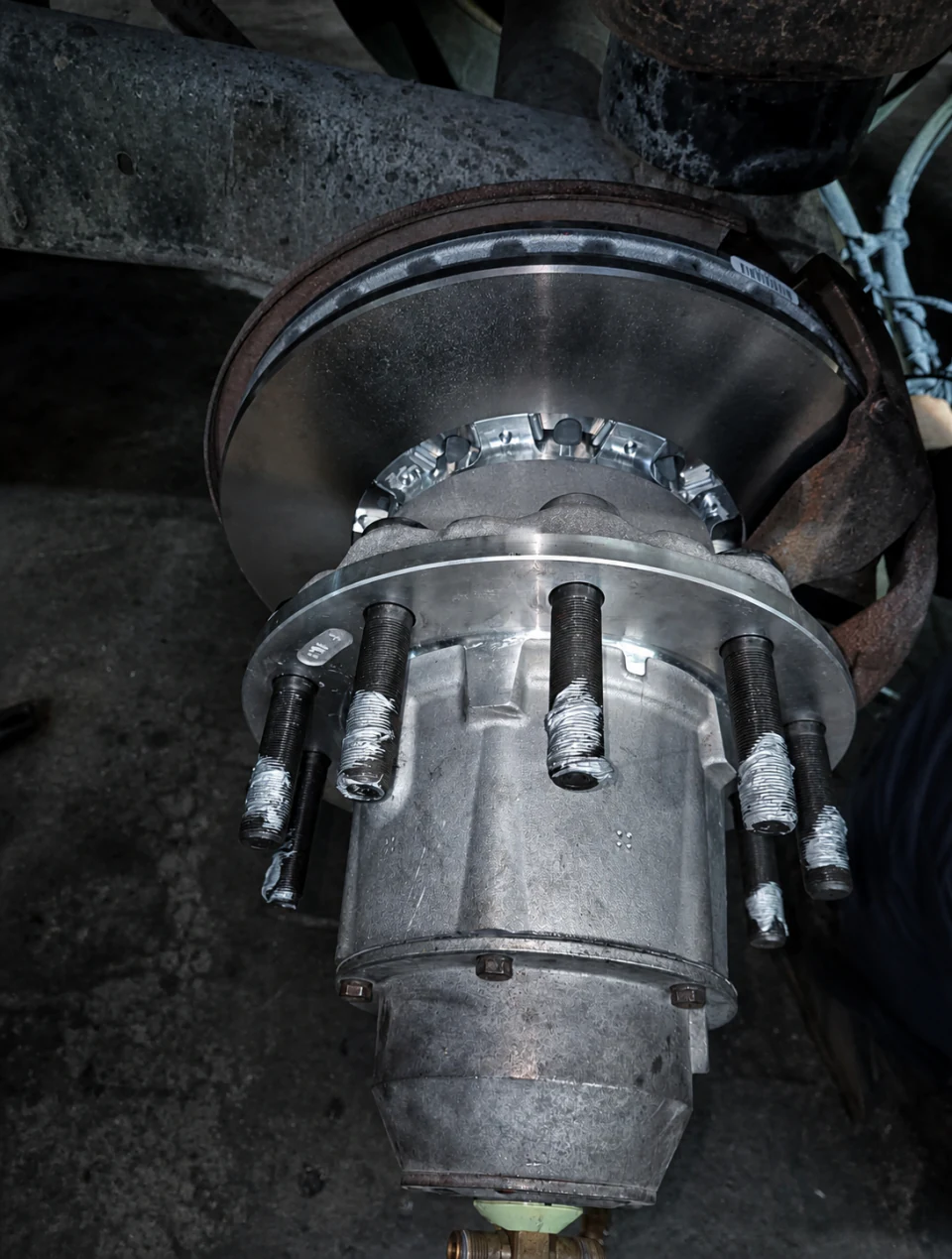 Close-up of a heavy-duty truck wheel hub and brake drum at Big Truck & Trailer Repair in Park City, Illinois